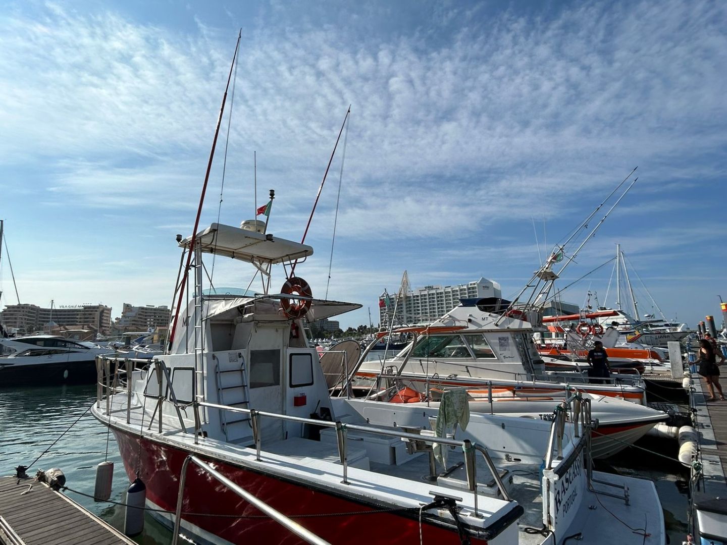 a boat is docked next to a body of water