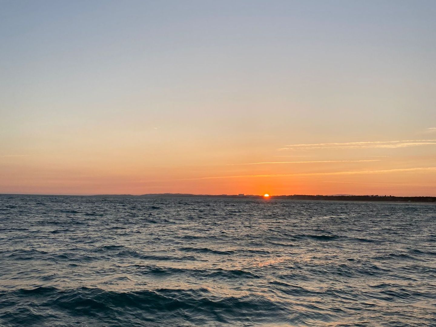 a sunset over a body of water