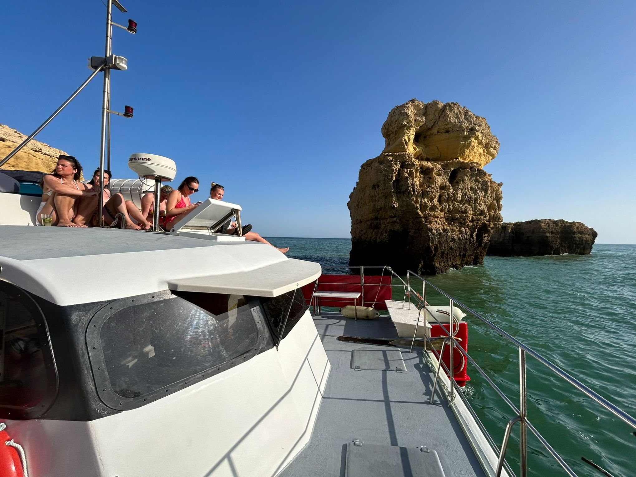 a group of people riding on the back of a boat