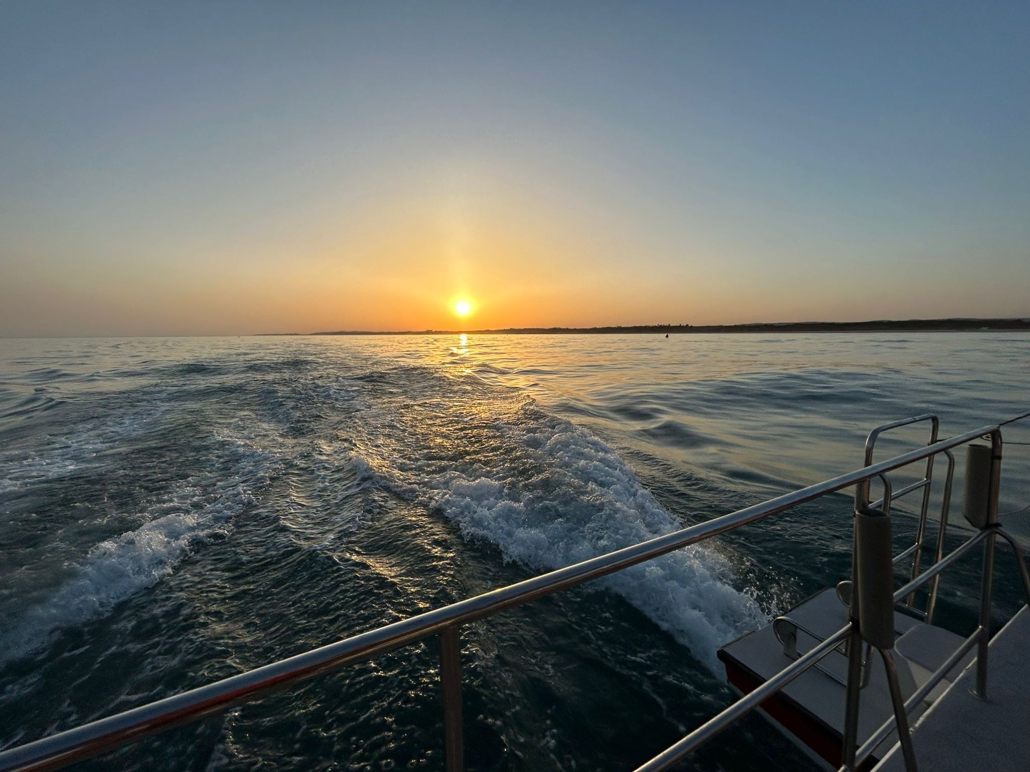 a sunset over a body of water