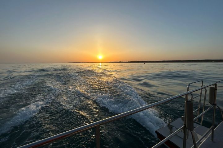 a sunset over a body of water