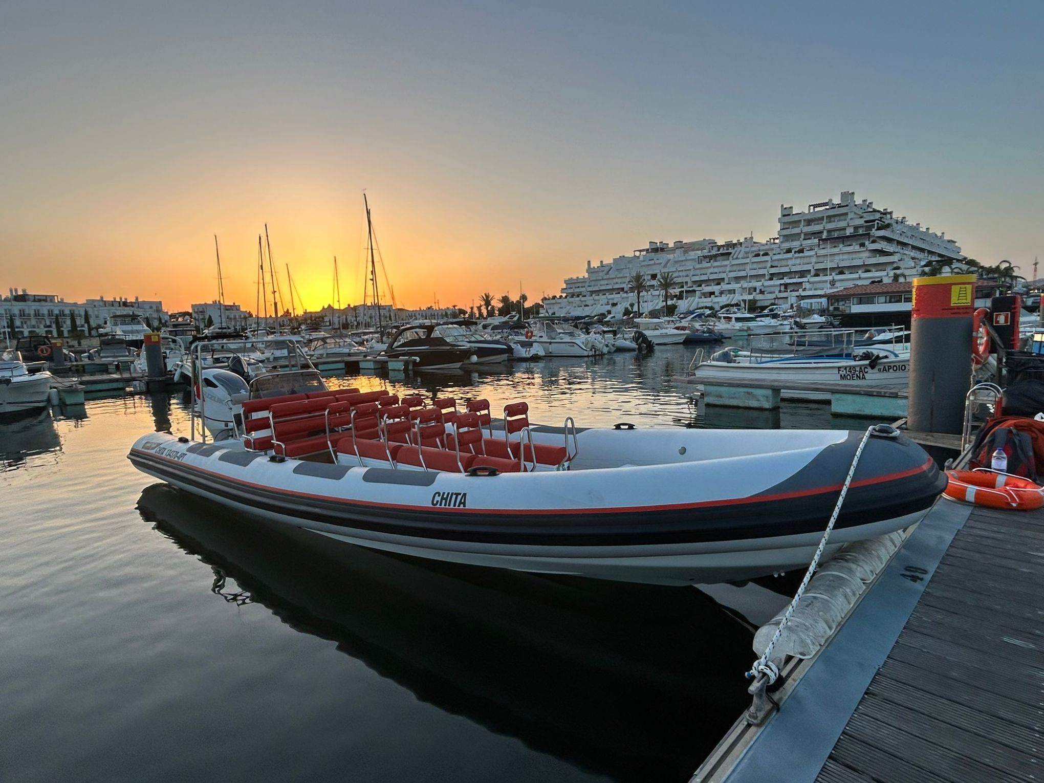 a boat is docked next to a body of water